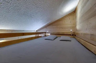Un ou plusieurs lits dans un hébergement de l'établissement CHANTELOUVE Tres bel appartement avec une jolie Vue