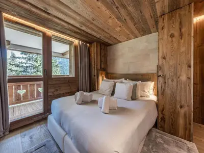 Un ou plusieurs lits dans un hébergement de l'établissement Duplex Ski in/out 5 pers, 2 ch, 3 sdb, Balcon, WIFI - Courchevel 1650 - FR-1-631-208