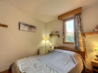 Un ou plusieurs lits dans un hébergement de l'établissement Appartement cosy pour 5, vue montagne, wifi inclus - FR-1-455-257