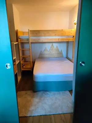 Un ou plusieurs lits dans un hébergement de l'établissement Appartement 5 p Belle Plagne Skis aux pieds
