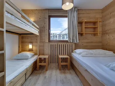 Un ou plusieurs lits dans un hébergement de l'établissement Appartement rénové 2 pièces, proche pistes, balcon - FR-1-502-575