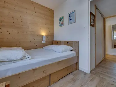 Un ou plusieurs lits dans un hébergement de l'établissement Appartement rénové 2 pièces, proche pistes, balcon - FR-1-502-575