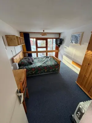 Un ou plusieurs lits dans un hébergement de l'établissement Duplex arcs 1800 aux pieds des pistes