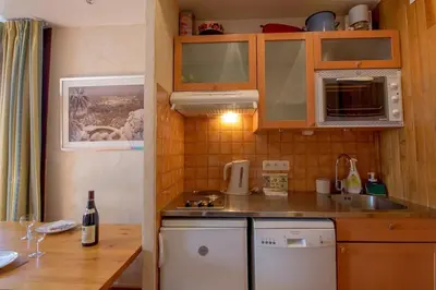 Cuisine ou kitchenette dans l'établissement Studio 3 personnes avec place de parking couverte
