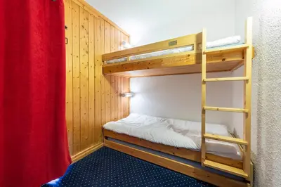 Un ou plusieurs lits dans un hébergement de l'établissement Appartement ambiance cosy Les ARCS 1800