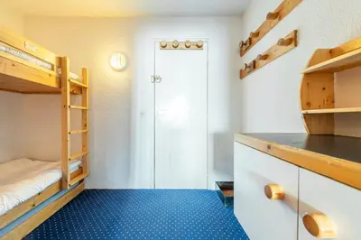 Un ou plusieurs lits dans un hébergement de l'établissement Appartement ambiance cosy Les ARCS 1800