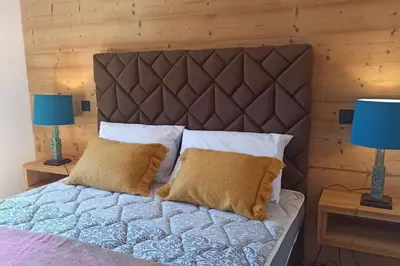 Un ou plusieurs lits dans un hébergement de l'établissement Paradiski nouveau, cosy et ensoleillé plan Peisey