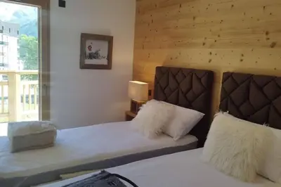 Un ou plusieurs lits dans un hébergement de l'établissement Paradiski nouveau, cosy et ensoleillé plan Peisey
