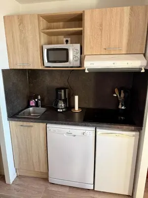 Cuisine ou kitchenette dans l'établissement Résidence Licorne BELLE PLAGNE