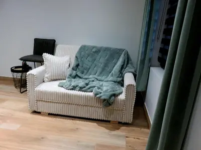 Coin salon dans l'établissement Appartement T2 neuf et moderne