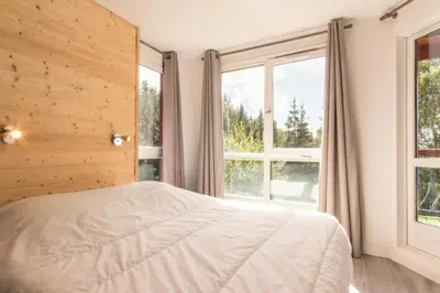Un ou plusieurs lits dans un hébergement de l'établissement Résidence Aiguille Des Glaciers - Spacieux appartement 4 pièces 8 personnes MAE-4604
