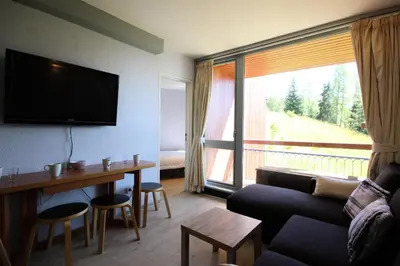 Télévision ou salle de divertissement dans l'établissement Résidence Grand Arbois - Deux pièces 4/5 personnes centre station MAE-5204