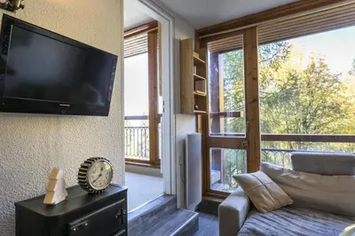 Télévision ou salle de divertissement dans l'établissement Résidence Grand Arbois - Deux pièces 4 personnes rénové centre station MAE-5394