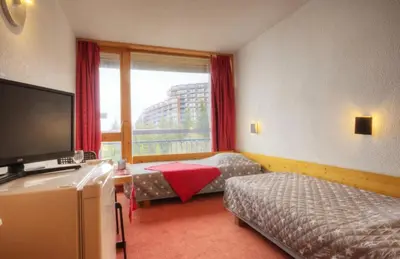 Un ou plusieurs lits dans un hébergement de l'établissement Résidence Grand Arbois - Studio 2 personnes centre station MAE-6594
