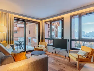 Coin salon dans l'établissement Appartement neuf avec terrasse, SPA et parking inclus - 6 pers - FR-1-352-103