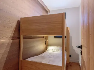 Un ou plusieurs lits dans un hébergement de l'établissement Appartement neuf avec terrasse, SPA et parking inclus - 6 pers - FR-1-352-103