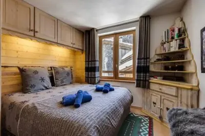 Un ou plusieurs lits dans un hébergement de l'établissement Chalet Ancolie 2e Appartement cosy dans un chalet