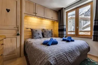 Un ou plusieurs lits dans un hébergement de l'établissement Chalet Ancolie 2e Appartement cosy dans un chalet