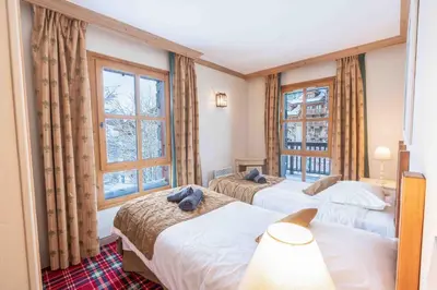 Un ou plusieurs lits dans un hébergement de l'établissement Arc 1950 - 2 bed ski-in ski-out with stunning views