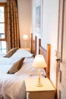 Un ou plusieurs lits dans un hébergement de l'établissement Arc 1950 - 2 bed ski-in ski-out with stunning views