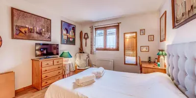 Un ou plusieurs lits dans un hébergement de l'établissement Chalet Le Prairial - Chalets pour 8 Personnes MAE-0071