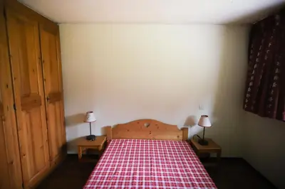 Un ou plusieurs lits dans un hébergement de l'établissement Chalet Alpina résidence Val Claret