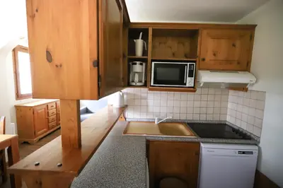 Cuisine ou kitchenette dans l'établissement Chalet Alpina résidence Val Claret