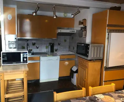 Cuisine ou kitchenette dans l'établissement MyHome - Génépis 35 - Duplex 6 pax skis aux pieds - Val Claret