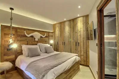 Un ou plusieurs lits dans un hébergement de l'établissement ARC 1950, Appartement style Chalet Haut de Gamme 2 chambres, 6 personnes