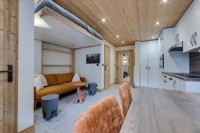 Télévision ou salle de divertissement dans l'établissement Appartement Ski aux Pieds 2100m - Le Nid Tignes Val Claret
