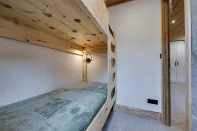 Un ou plusieurs lits dans un hébergement de l'établissement Appartement Ski aux Pieds 2100m - Le Nid Tignes Val Claret