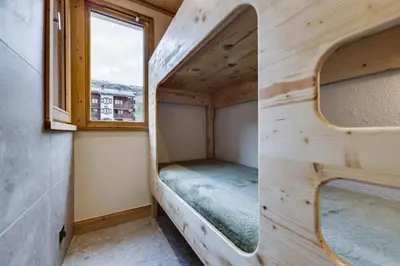 Un ou plusieurs lits dans un hébergement de l'établissement Appartement Ski aux Pieds 2100m - Le Nid Tignes Val Claret