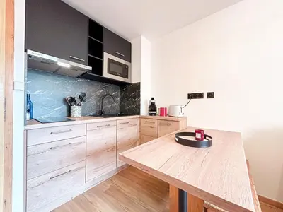 Cuisine ou kitchenette dans l'établissement A 2 Pas des Pistes - Vue Imprenable !