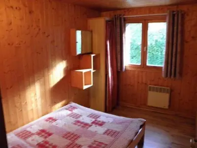 Un ou plusieurs lits dans un hébergement de l'établissement Chalet Les Eterlous