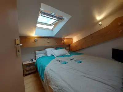 Un ou plusieurs lits dans un hébergement de l'établissement Appartement cosy - 3 personnes