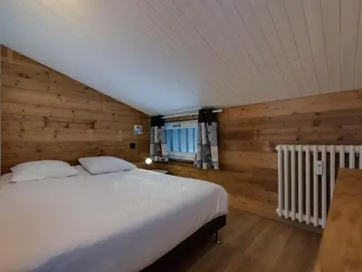 Un ou plusieurs lits dans un hébergement de l'établissement Appartement rénové 3 pièces à Tignes, balcon, proche pistes, WIFI - FR-1-502-591