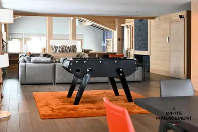 Coin salon dans l'établissement Chalet Licorne - Chalet de prestige au Belvédère MAE-3924