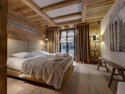 Un ou plusieurs lits dans un hébergement de l'établissement Chalet 12 pers, Piscine, Hammam, Proche pistes, Val d'Isère - FR-1-567-129