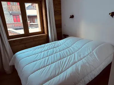 Un ou plusieurs lits dans un hébergement de l'établissement Appartement neuf avec terrasse sud, parking privatif, 3 pièces, 6 pers - FR-1-464-235