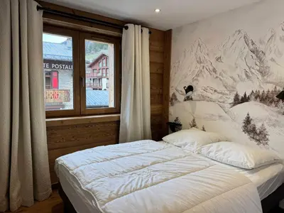 Un ou plusieurs lits dans un hébergement de l'établissement Appartement cosy au pied des pistes avec parking privatif - FR-1-464-242