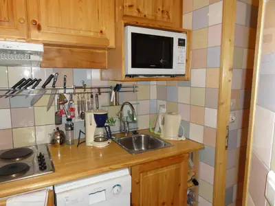 Cuisine ou kitchenette dans l'établissement Les myrtilles Studio