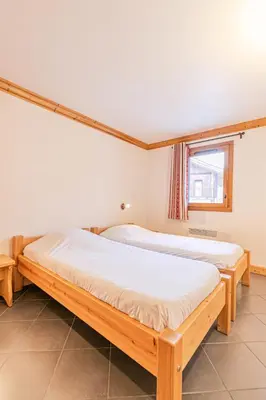 Un ou plusieurs lits dans un hébergement de l'établissement Résidence Le Criterium - Résidence Le Critérium 3 Chalet B Appartement 1 MAE-4381