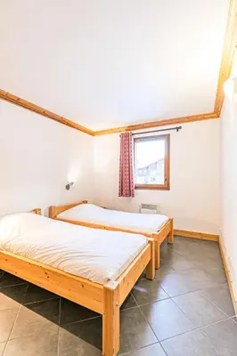 Un ou plusieurs lits dans un hébergement de l'établissement Résidence Le Criterium - Résidence Le Critérium 3 Chalet D Appartement 1 MAE-4451