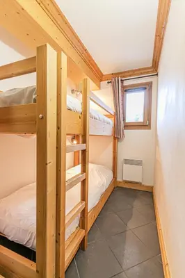 Un ou plusieurs lits dans un hébergement de l'établissement Résidence Le Criterium - Résidence Le Critérium 3 Chalet B Appartement 2 MAE-4511