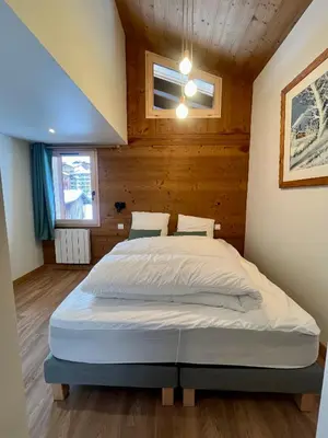 Un ou plusieurs lits dans un hébergement de l'établissement CHALET - DUPLEX neuf 8 pax - pied des pistes - parking privé - cheminée - Skiroom - 3 rooms & mezzanine