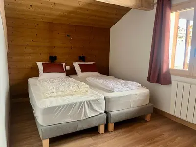 Un ou plusieurs lits dans un hébergement de l'établissement CHALET - DUPLEX neuf 8 pax - pied des pistes - parking privé - cheminée - Skiroom - 3 rooms & mezzanine