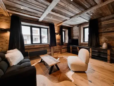 Coin salon dans l'établissement Alpina Lodge - appartement Premium avec Sauna à Val Cenis