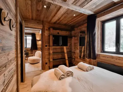 Un ou plusieurs lits dans un hébergement de l'établissement Alpina Lodge - appartement Premium avec Sauna à Val Cenis