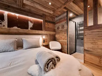 Un ou plusieurs lits dans un hébergement de l'établissement Alpina Lodge - appartement Premium avec Sauna à Val Cenis