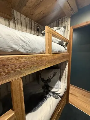 Un ou plusieurs lits superposés dans un hébergement de l'établissement MyHome - L'Absinthe Bleue - Appartement 4-6 personnes neuf 4 étoiles - balcon sud- ski aux pieds - Tignes Val Claret